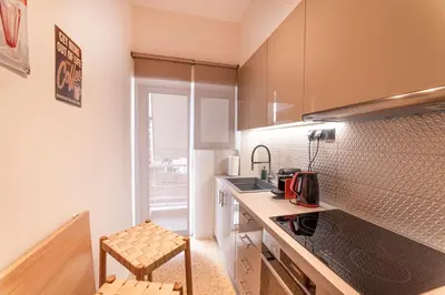 a small kitchen with a counter and a sink at Mary's Haven Apt near metro station and Acropolis in Athens