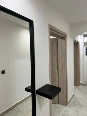 a room with a door and a black shelf at Charming 2BR Basement near Akropolis Athens by Kozy Koala in Athens