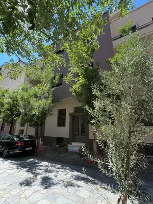 a building with a car parked in front of it at Charming 2BR Basement near Akropolis Athens by Kozy Koala in Athens