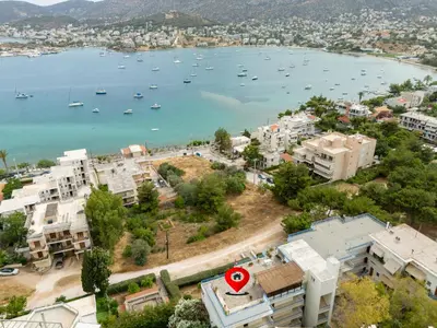 an aerial view of a city with boats in the water at DOMUS by A&D Properties in Porto Rafti