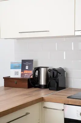 a coffee pot on a counter in a kitchen at DOMUS by A&D Properties in Porto Rafti