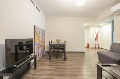 a living room with a table and a couch at Apartment Steps From Historic Center Plaka in Athens
