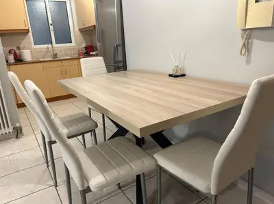 a kitchen with a wooden table and four chairs at D2 Apartment - Athens Oasis in Athens