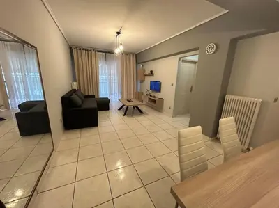 a living room with a couch and a table at D2 Apartment - Athens Oasis in Athens