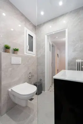 a bathroom with a toilet and a sink at Sea Breeze 2 bedroom Apartment - 10 min walk to beach in Athens