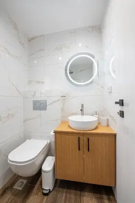 a bathroom with a sink and a toilet and a mirror at SoulPoint Near City in Athens