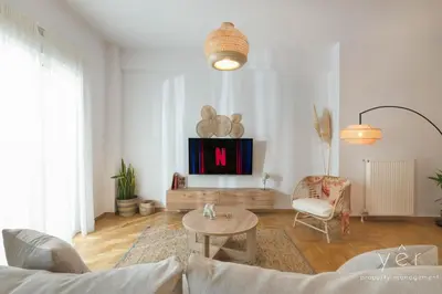a living room with a couch and a table at Free-Spirit Large Boho Apartment with Free-Parking in Athens