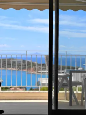 a balcony with a table and a view of the ocean at Raise Riviera Panoramic Sea View apartment in Athens