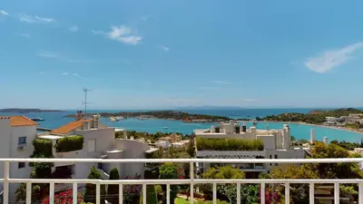 a view of a harbor from a balcony of a building at Raise Riviera Panoramic Sea View apartment in Athens