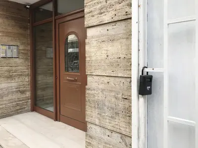a wooden door on the side of a building at Zorba Meets Buddha in Athens