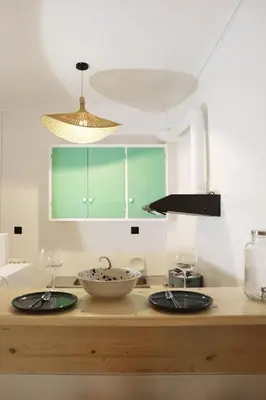a kitchen with two bowls on top of a counter at Zorba Meets Buddha in Athens