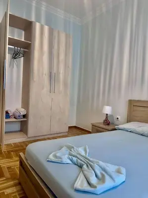 a bedroom with a bed with towels on it at Jorges house in athens in Athens