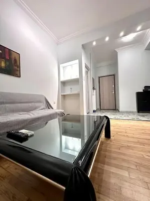 a room with a bed and a glass table at Jorges house in athens in Athens