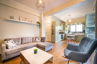 a living room with a couch and a table at ΜΚ Αpartment 2ΥΔ - Nikea Metro in Piraeus