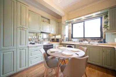 a kitchen with a table and chairs and a window at ΜΚ Αpartment 2ΥΔ - Nikea Metro in Piraeus