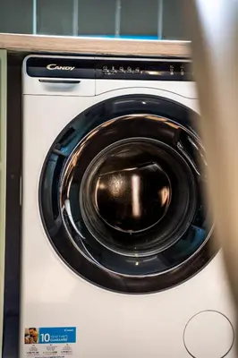 a white washing machine with a black door at ΜΚ Αpartment 2ΥΔ - Nikea Metro in Piraeus