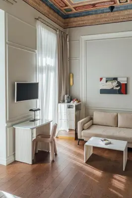 a living room with a couch and a table at Nosteo in Athens