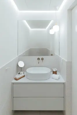 a white bathroom with a white sink and mirrors at Nosteo in Athens