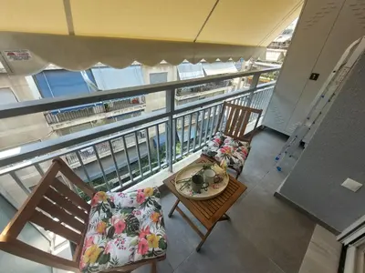 an overhead view of a balcony with chairs and a table at Maddie's Apartment in Athens