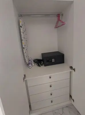 a closet with a dresser with a black appliance on it at Maddie's Apartment in Athens