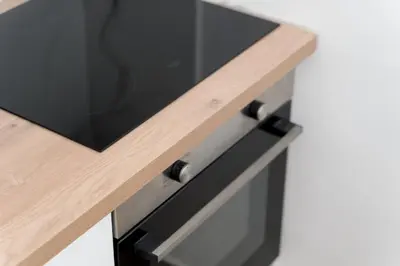 a wooden table with a tv on top of a counter at Sandlight Apartment by A&D Properties in Porto Rafti