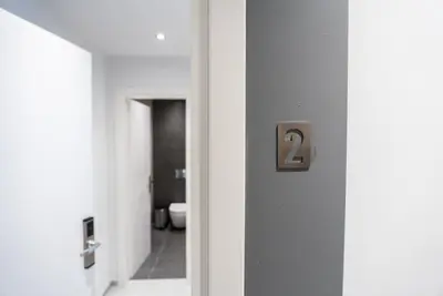 a hallway with a door with a number two on it at Tranquility 248 in Athens