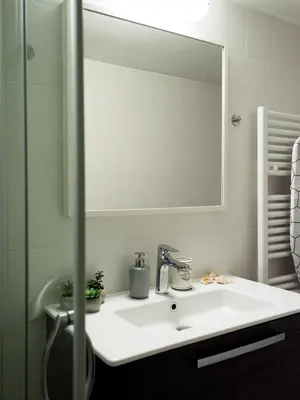 a bathroom with a sink and a mirror at Urban Nights Athens in Athens