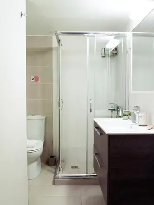 a bathroom with a shower and a sink and a toilet at Urban Nights Athens in Athens