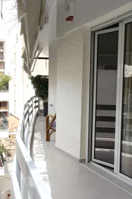 a balcony with a sliding glass door on a building at 