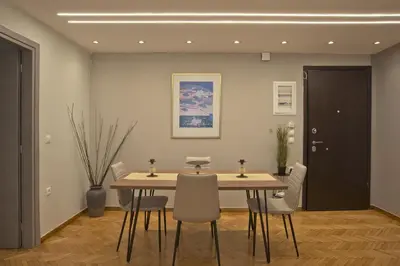 a dining room with a table and chairs at Honey House Kipseli Stylish, Reno 2BR Apt City Ctr in Athens