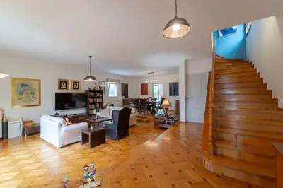 a living room with a staircase and a living room at Private Entire Villa in Alimos in Athens