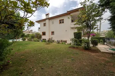 a house with a large yard in front of it at Private Entire Villa in Alimos in Athens