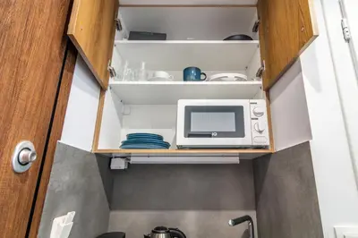 a tiny kitchen with a microwave oven and a microwave at Modern Studio in Syntagma - Walk to Acropolis in Athens
