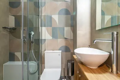 a bathroom with a toilet and a sink and a shower at Modern Studio in Syntagma - Walk to Acropolis in Athens