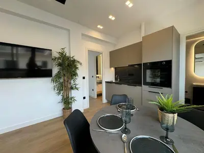 a kitchen and dining room with a table and chairs at BlueMotion - CruiseNest 6Β in Piraeus