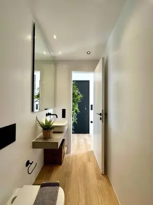 a bathroom with a sink and a mirror at BlueMotion - CruiseNest 6Α in Piraeus