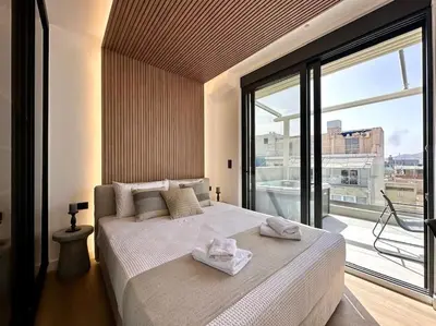 a bedroom with a large bed with towels on it at BlueMotion - CruiseNest 6Α in Piraeus