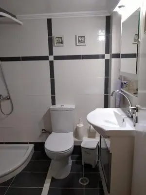 a bathroom with a toilet and a sink and a tub at Classical beauty near Acropolis! in Athens