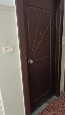 a wooden door with a knob in a room at Classical beauty near Acropolis! in Athens
