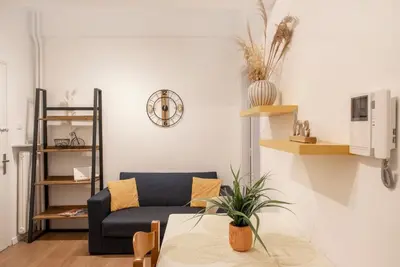 a living room with a couch and a table at Alkisti in Athens