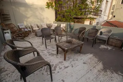 a group of chairs and tables on a patio at Athens city center small penthouse in Athens