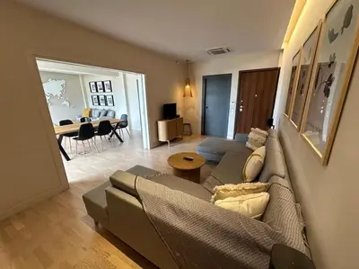 a living room with a couch and a table at D-Marin Zea Marina 2 Bedroom in Piraeus