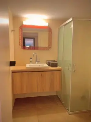 a bathroom with a sink and a mirror at D-Marin Zea Marina 2 Bedroom in Piraeus