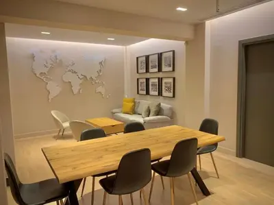 a conference room with a wooden table and chairs at D-Marin Zea Marina 2 Bedroom in Piraeus