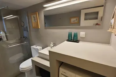 a bathroom with a sink and a toilet and a mirror at \u8ff7\u4eba\u82b1\u56ed\u516c\u5bd3 Charming Garden in Athens