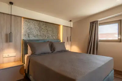 a bedroom with a large bed and a window at Wellnest Hotel in Athens