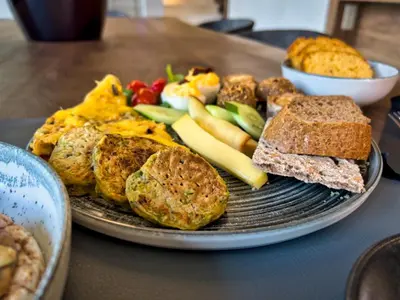 a plate of breakfast food with bread and toast at Wellnest Hotel in Athens