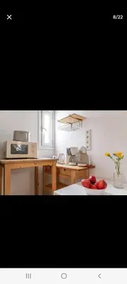 a kitchen with a plate of apples on a table at Dreaming of Greece G1 in Athens