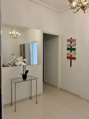 a room with a table and a sign on the wall at Dreaming of Greece G1 in Athens