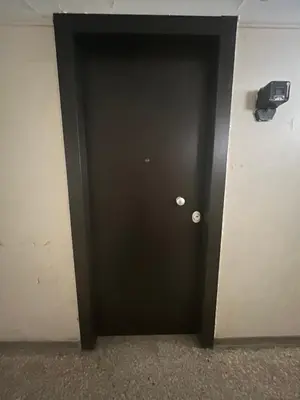a black door with a white wall at Athenian Urban Art Apartment - Live Athenian Life in Athens
